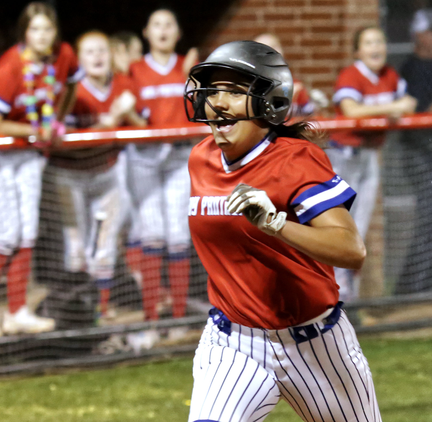 Lady Panther Erin Langston scores by stealing home.